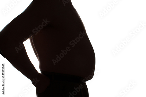 Obraz na płótnie Silhouette of an adult man on a white isolated background with the big fat belly overweight. w salonie