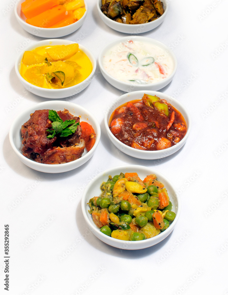 Set menu dishes for Sri Lankan style Chicken Briyani on white background. Set menu dishes for Sri Lankan style Chicken Briyani on white background.