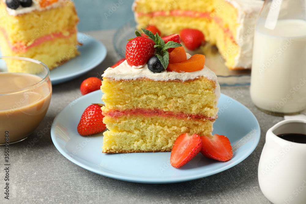 Composition with delicious berry cream cake on gray background. Tasty dessert Composition with delicious berry cream cake on gray background. Tasty dessert