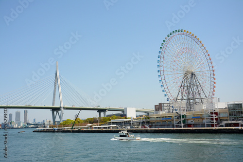 City scene  with sky wheels and  cross sea bridge Osaka © young