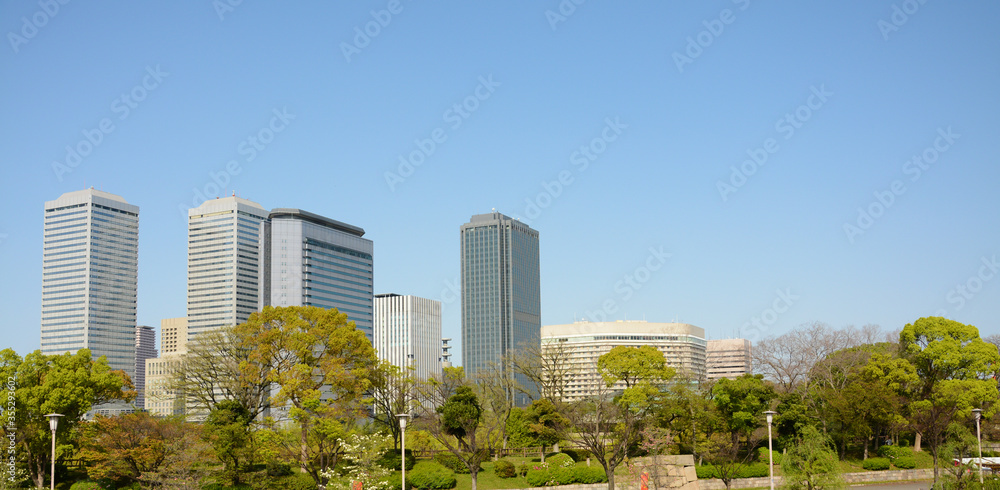 City scene with buildings and trees in Osaka