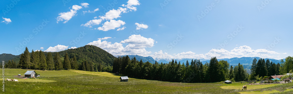 Panorama of the Bavarian Alps on a sunny-cloudy day in Allgäu, Germany
