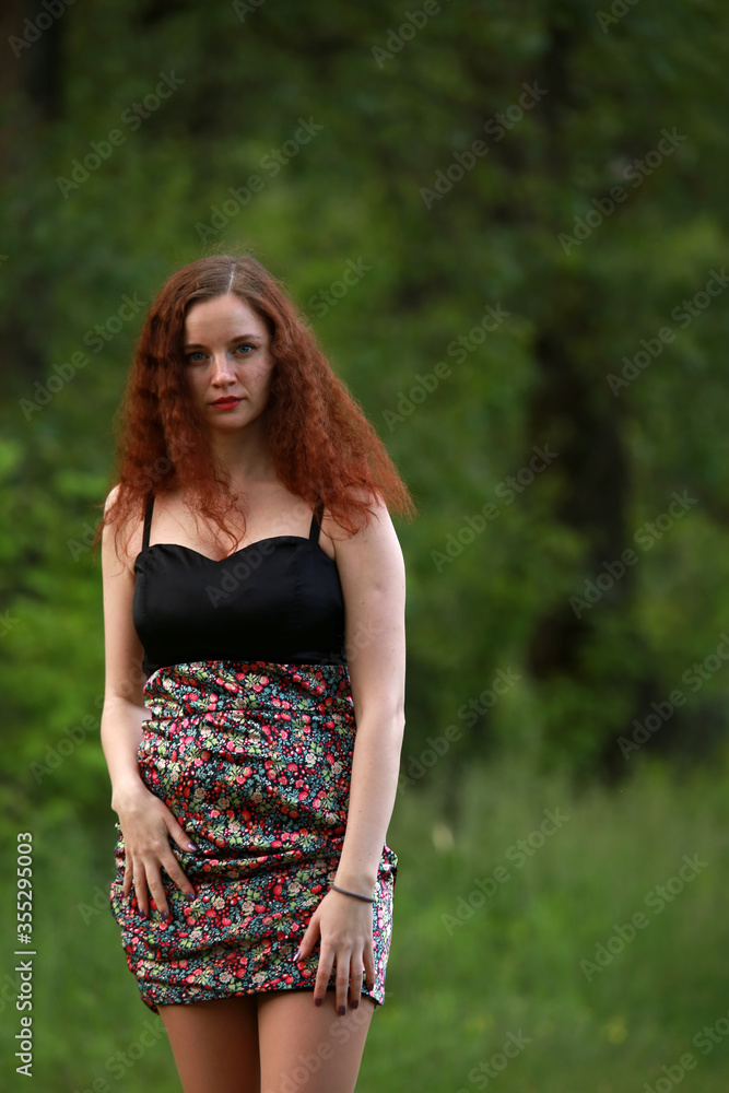 Portrait of brown haired woman outside 