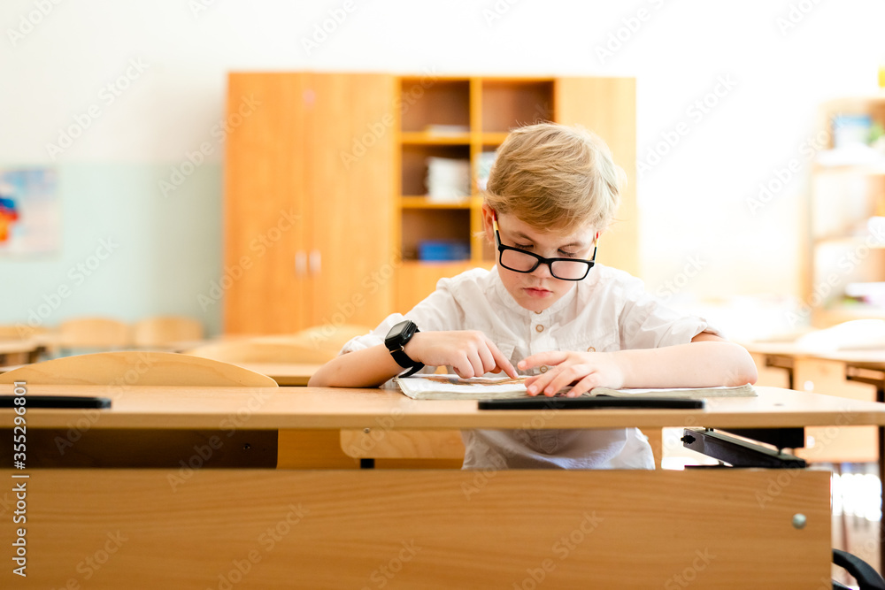 Education, high school, college. Portrait of a funny shouting student boy standing by a school blackboard Education, high school, college. Portrait of a funny shouting student boy standing by a school blackboard