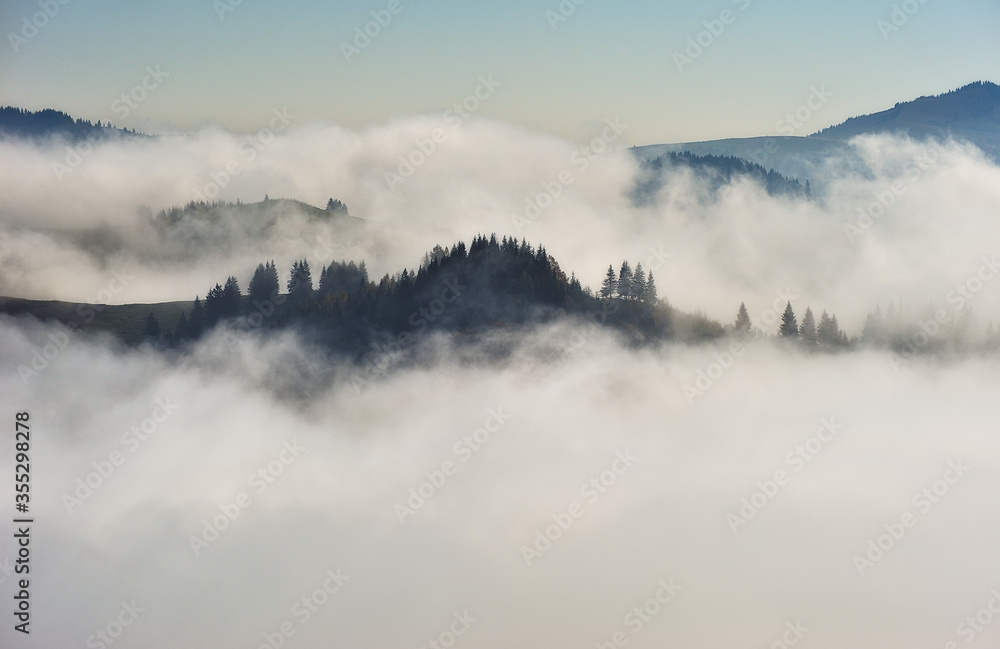 Predawn time in the highlands. mountain silhouettes in the fog Predawn time in the highlands. mountain silhouettes in the fog
