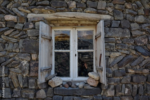 window in stone wall