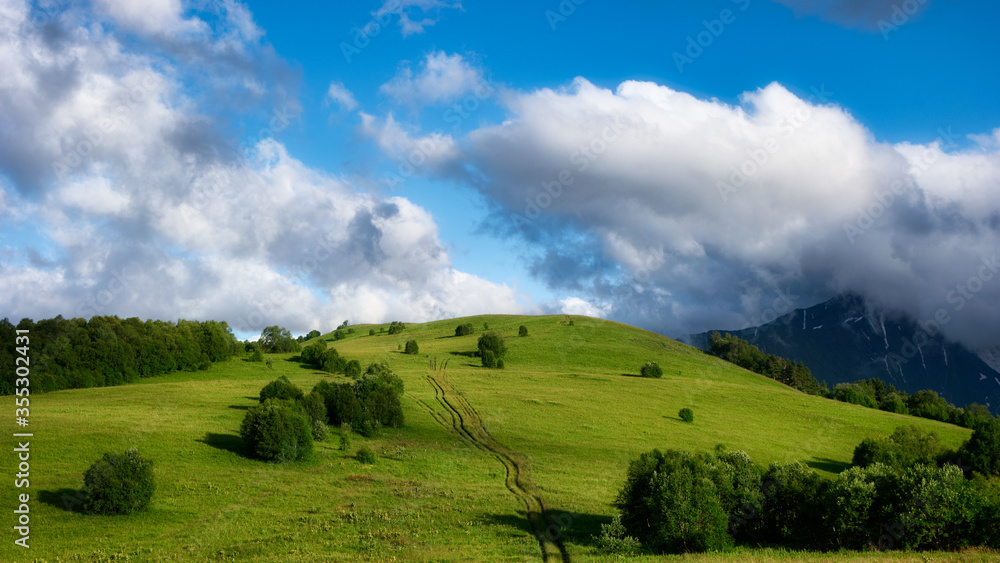 Mountain valley during bright sunrise. Beautiful natural landscape. Adygea Mountain valley during bright sunrise. Beautiful natural landscape. Adygea
