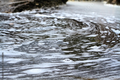 Fototapeta Naklejka Na Ścianę i Meble -  water flowing into the water