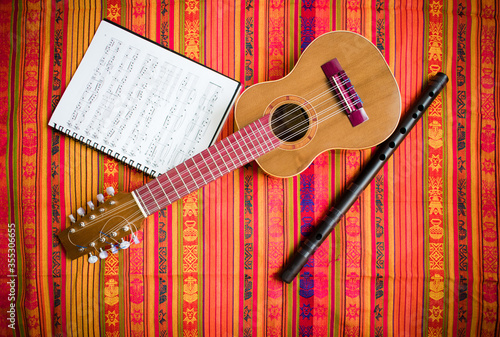 Charango, Quena and Music Sheet  on Andean Pattern blanket  photo