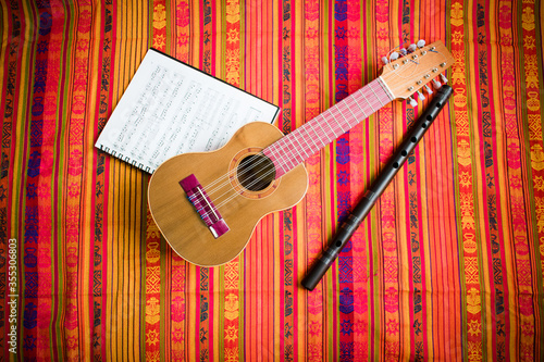Charango, Quena and Music Sheet  on Andean Pattern blanket 