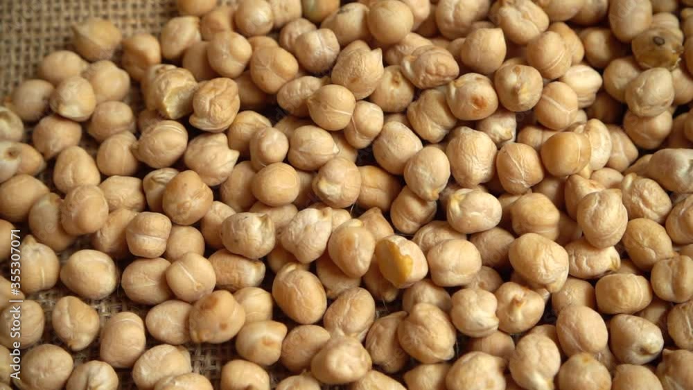 Chickpeas on burlap. Slow motion. Chickpeas on burlap. Slow motion.