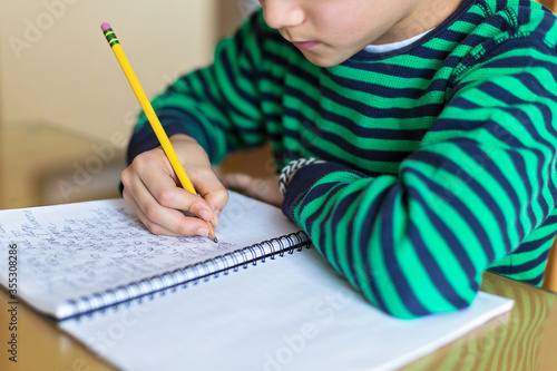 child writing cursive