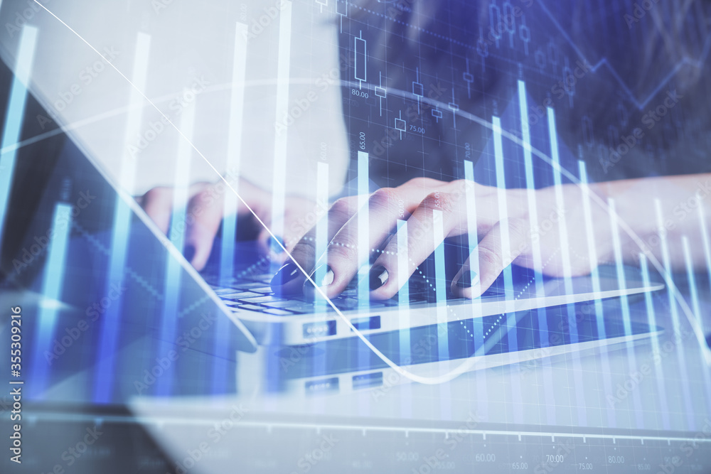 Double exposure of woman hands typing on computer and forex chart hologram drawing. Stock market invest concept. Double exposure of woman hands typing on computer and forex chart hologram drawing. Stock market invest concept.