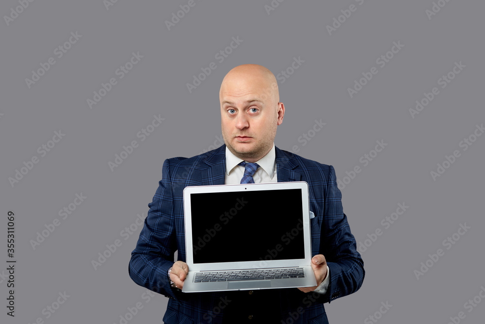 Surprised facial expression. A strict blue suit on a middle-aged man. Surprised facial expression. A strict blue suit on a middle-aged man.