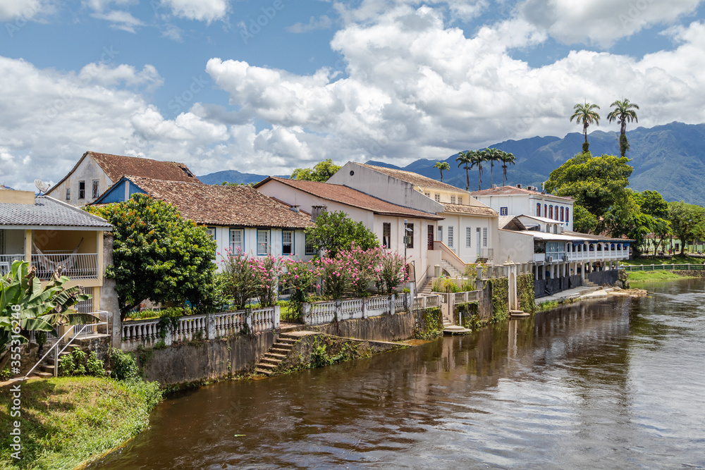 Landscape of the small town of Morretes, in the interior of Paraná, in the southern region of Brazil, with exuberant nature and houses by the river.