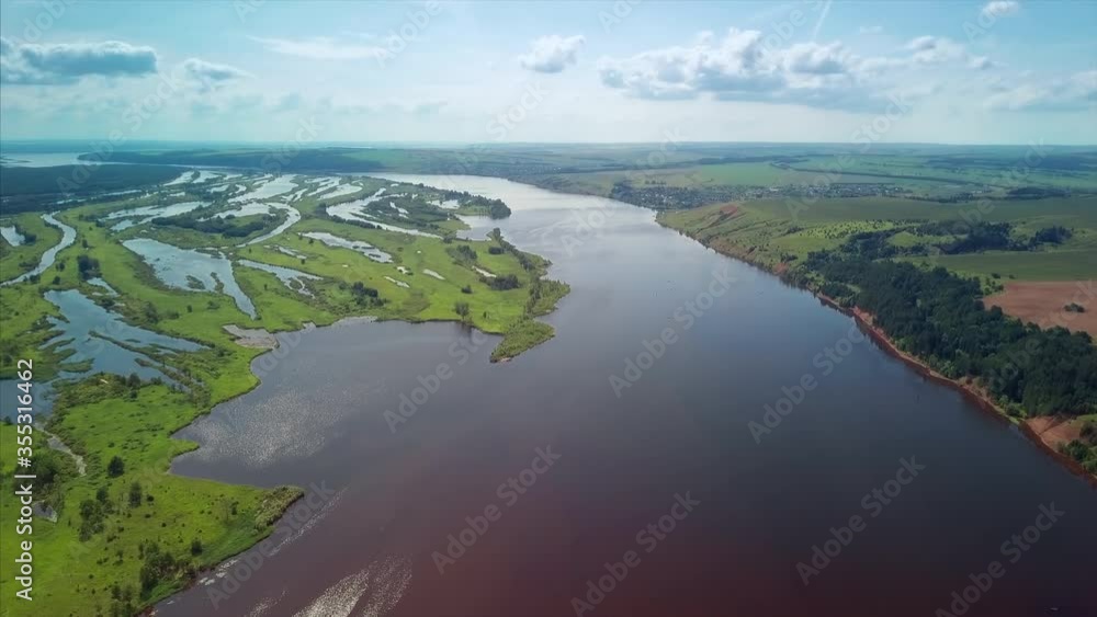 Aerial view of the river of Kama at sunny day. Area near the Nizhnekamsk Reservoir in Russia Aerial view of the river of Kama at sunny day. Area near the Nizhnekamsk Reservoir in Russia