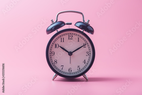  alarm clock on pink background