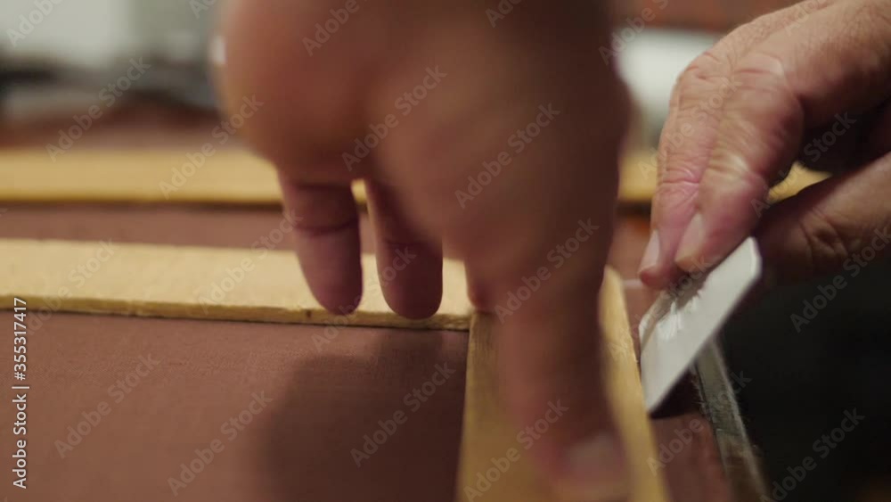 Tailor using chalk to mark a pattern in the fabric slow motion Tailor using chalk to mark a pattern in the fabric slow motion