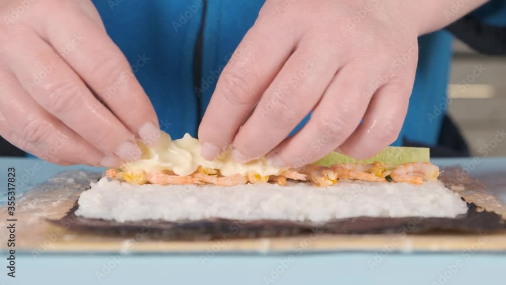 Recipe for making sushi rolls in the kitchen at home. Recipe for making sushi rolls in the kitchen at home.