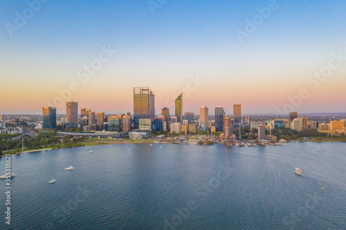 Sunset view of Perth across Swan river, Australia photo