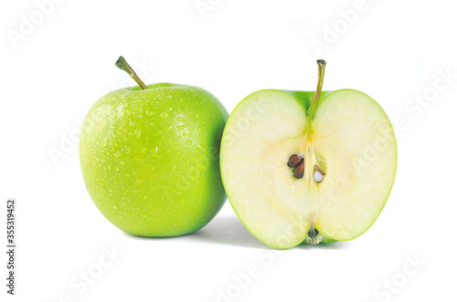 Whole green apple and half isolated on white background.