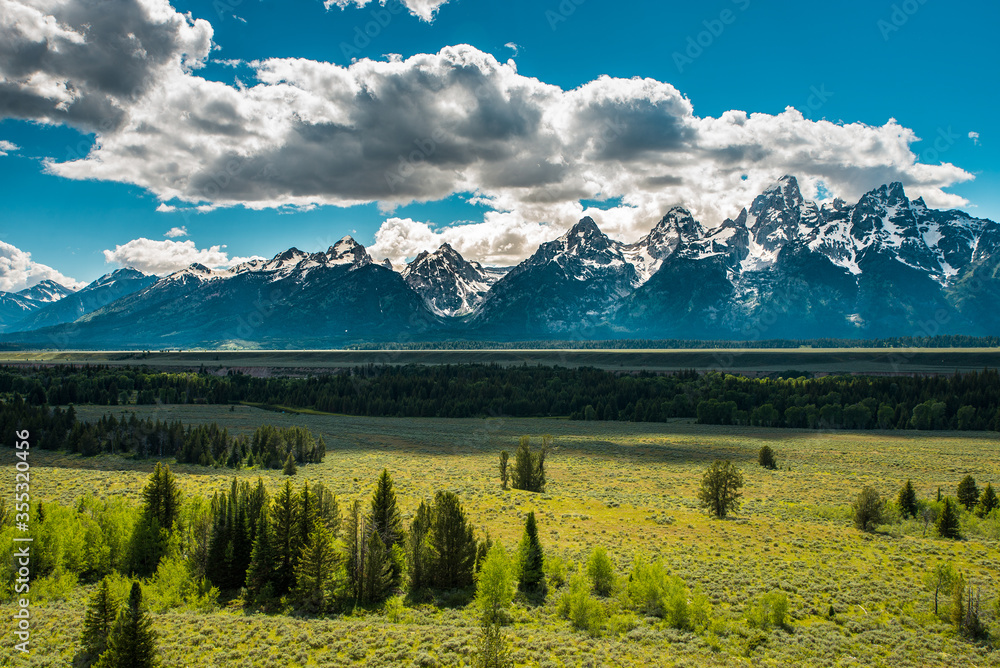 Landscape with mountains and clouds, Snowcapped Teton range, Grand Teton National Park, Wyoming