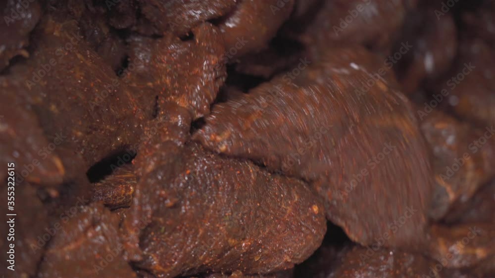 Working process machine in a food factory for mixing meat and spices for making hot dogs and sausages in a food factory. Close up. Part of sausage production. 4k Working process machine in a food factory for mixing meat and spices for making hot dogs and sausages in a food factory. Close up. Part of sausage production. 4k