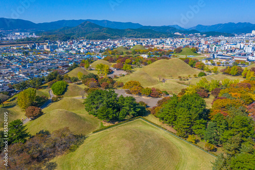 Panorama of Tumuli park and other royal tombs in the center of Korean town Gyeongju photo