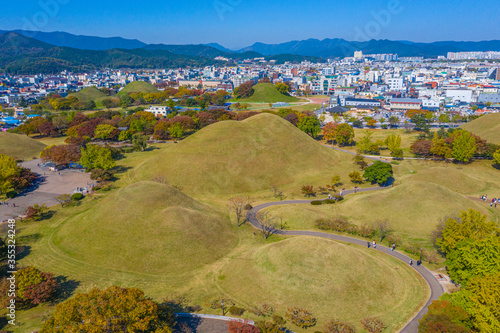 Panorama of Tumuli park and other royal tombs in the center of Korean town Gyeongju photo