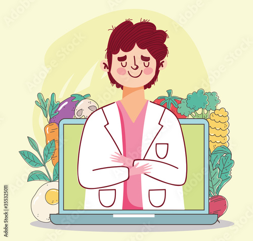dietitian doctor laptop and ingredients fresh market organic healthy food with fruits and vegetables