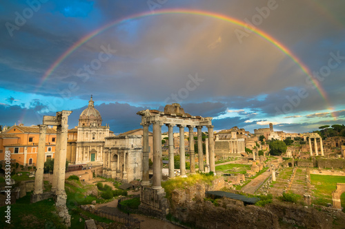 Canvas Print Beautiful sunset with rainbow in the Roman Forum ruins (Foro Romano) with Coloss