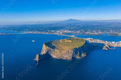 Sunrise view of Seongsan Ilchulbong known as sunrise peak at Jeju Island, Republic of Korea photo