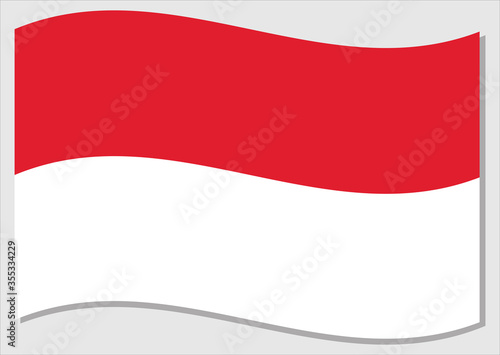 Waving flag of Monaco vector graphic. Waving Monegasque flag illustration. Monaco country flag wavin in the wind is a symbol of freedom and independence.
