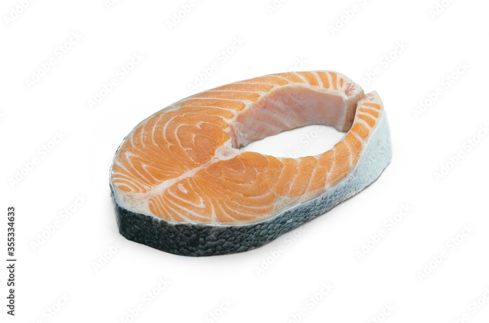 Fresh salmon fillets, seafood, cut into slices on a thin white background Fresh salmon fillets, seafood, cut into slices on a thin white background