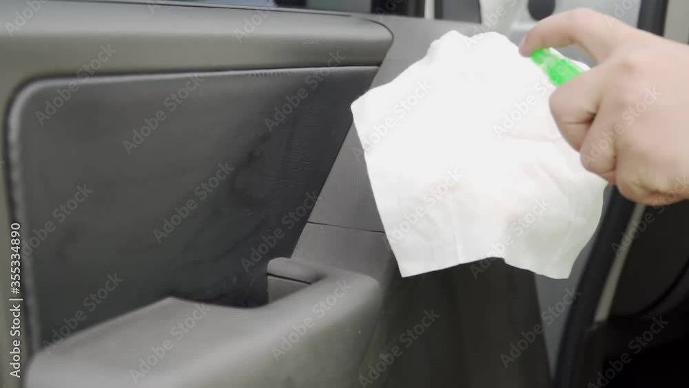 Footage B roll of hands Cleansing car interior and spraying with