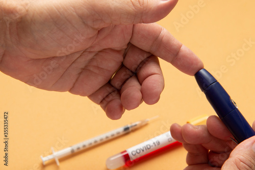 person doing fingertip test for blood glucose 