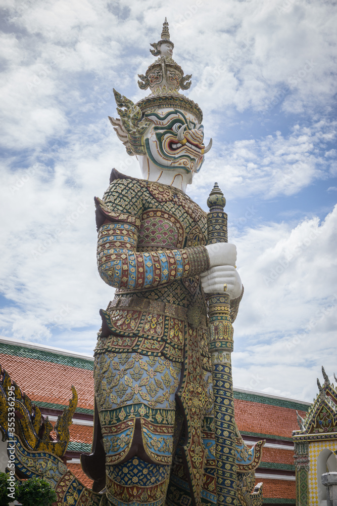 Fototapeta premium Giant statue at Temple of the Emerald Buddha (Wat phra kaew) ,Bangkok,Thailand.