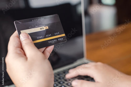 woman using a credit card for Online shopping on website.