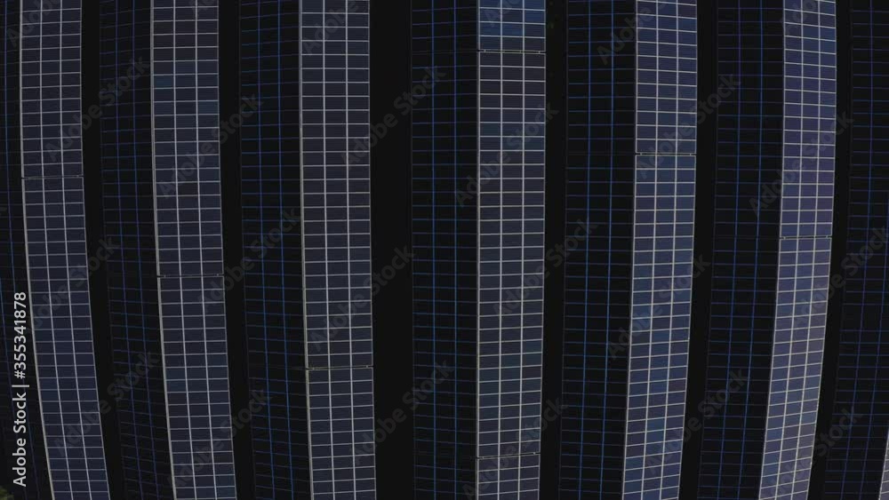 Aerial view of solar farm. Top view. Rows of modern photovoltaic solar panels. Renewable ecological source of energy from the sun. Aerial view of solar farm. Top view. Rows of modern photovoltaic solar panels. Renewable ecological source of energy from the sun.