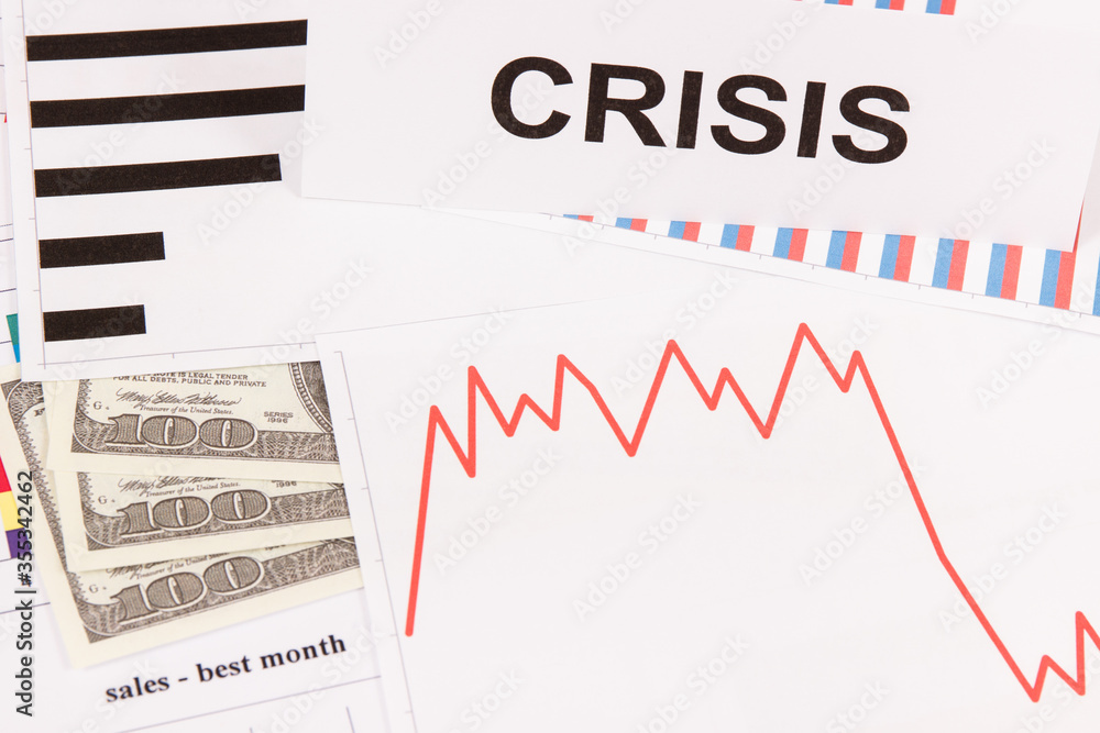 Inscription crisis, currencies dollar and declining chart as risk of financial crisis caused by coronavirus Inscription crisis, currencies dollar and declining chart as risk of financial crisis caused by coronavirus