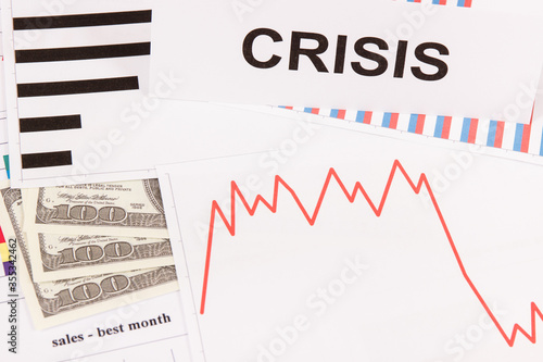 Inscription crisis, currencies dollar and declining chart as risk of financial crisis caused by coronavirus