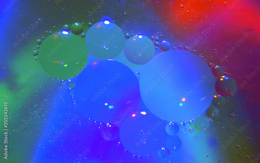 Oil drops in the water. Abstraction. Background. Macro shot. Oil drops in the water. Abstraction. Background. Macro shot.