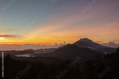 sunrise in Kintamani. crater view. Higher than clouds. rinjani view. High quality photo. Bali - island of gods. Indonesian mountains. view of three balinese volcanoes: Batur Abang Agung