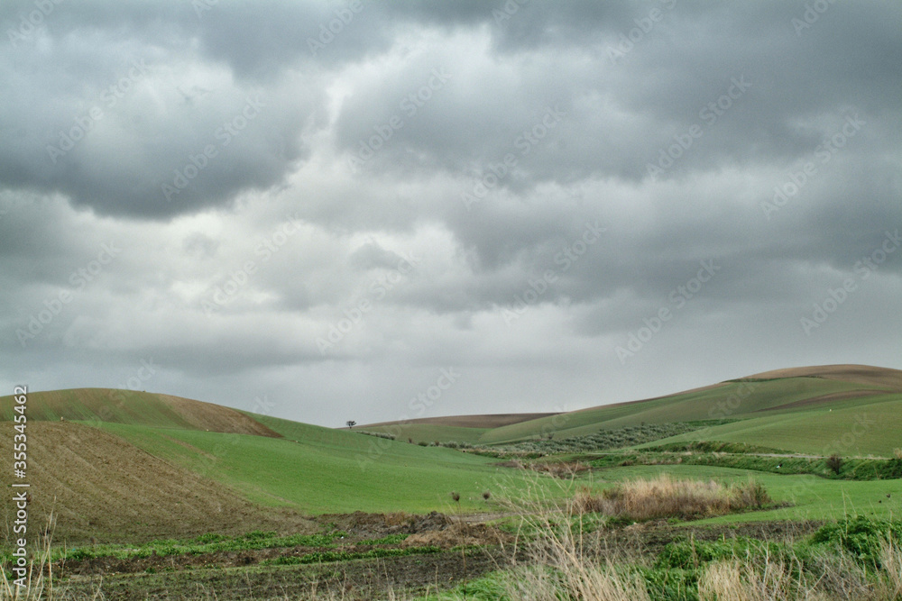 Lonely Art Nature Hills under cloudy sky stormy weather