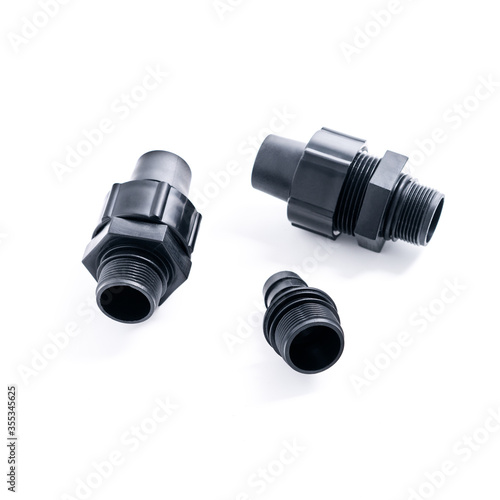 Plastic adapter couplings with thread on a white background