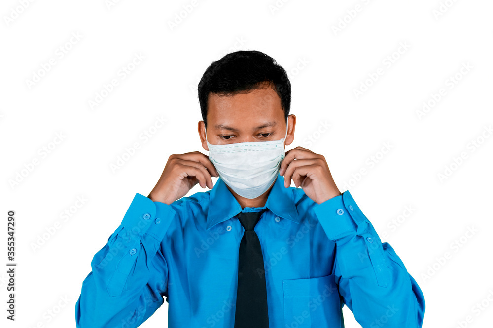 Businessman preparing by wearing medical mask Businessman preparing by wearing medical mask