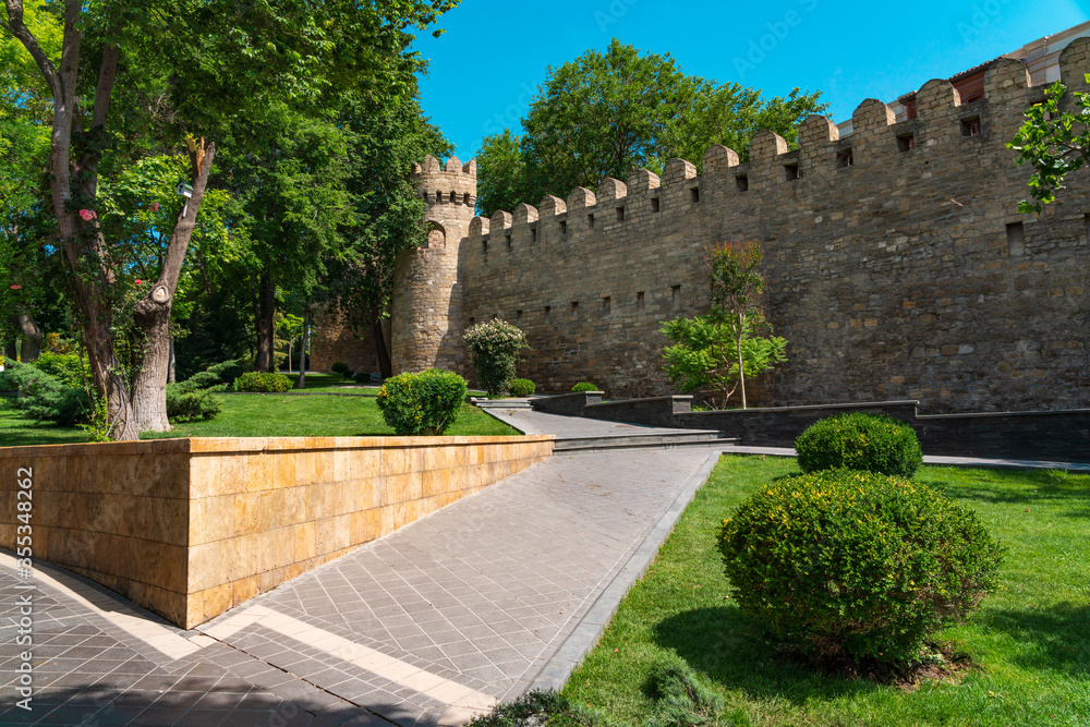 Alley in Governors Garden along the ancient fortress wall. Baku city, Azerbaijan