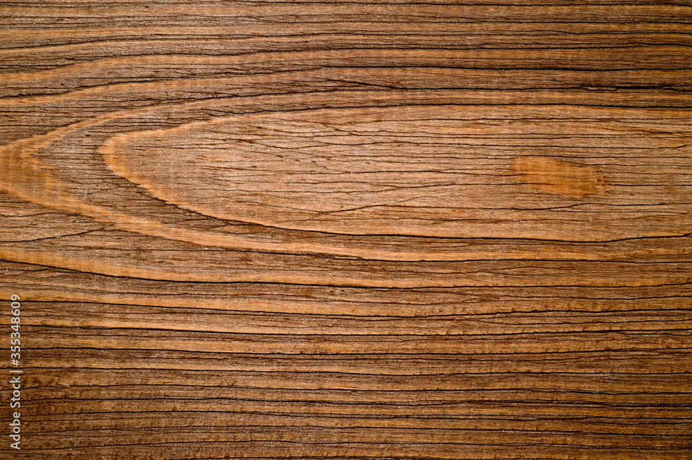 Fototapeta premium The texture of the wooden background consisting of boards painted in the color of wenge, designed for photographs.