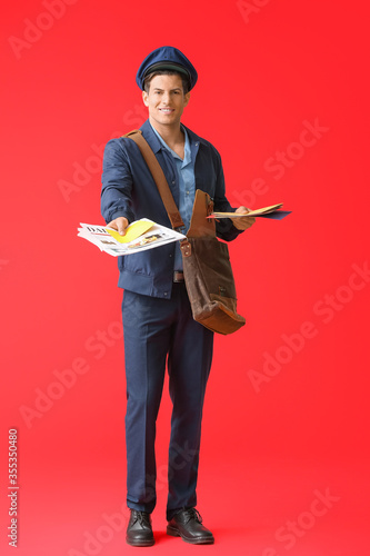 Handsome young postman on c...