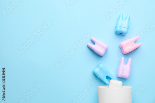Holder with teeth on color background